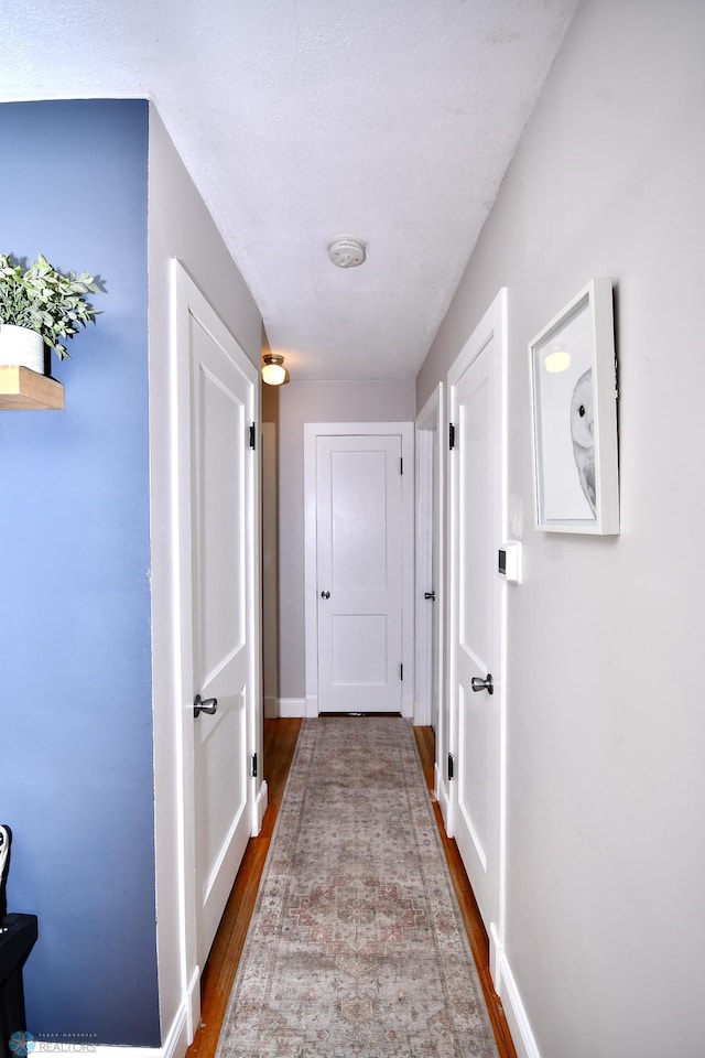 hall with light hardwood / wood-style flooring