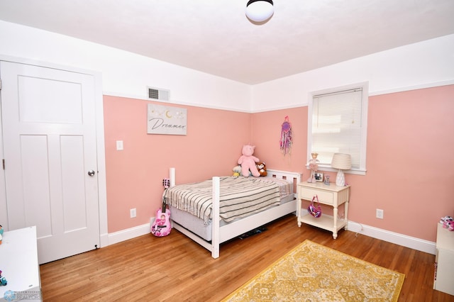 bedroom featuring hardwood / wood-style flooring