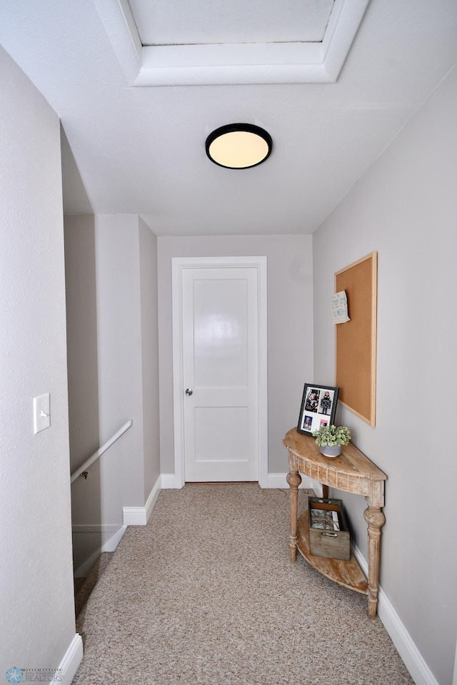 corridor with carpet flooring