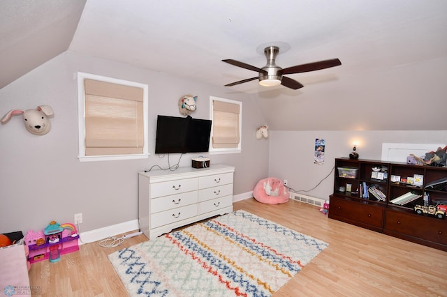 game room featuring lofted ceiling, ceiling fan, and light hardwood / wood-style floors