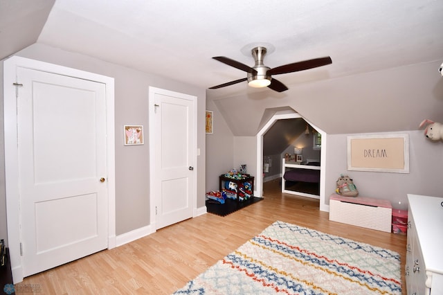 interior space featuring ceiling fan, hardwood / wood-style flooring, and lofted ceiling