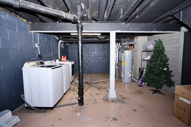 basement featuring independent washer and dryer and water heater