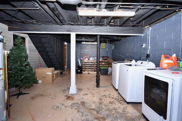 basement with washer and clothes dryer