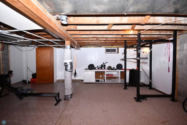 exercise area featuring tile patterned floors