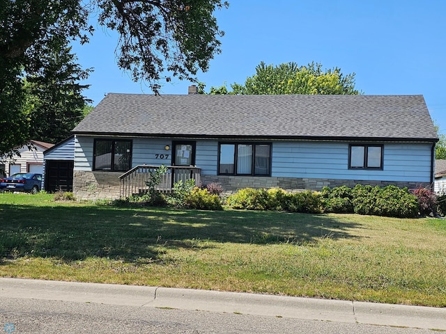 single story home featuring a front yard