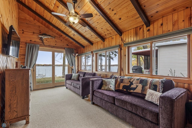 living room with light carpet, plenty of natural light, wood walls, and wood ceiling