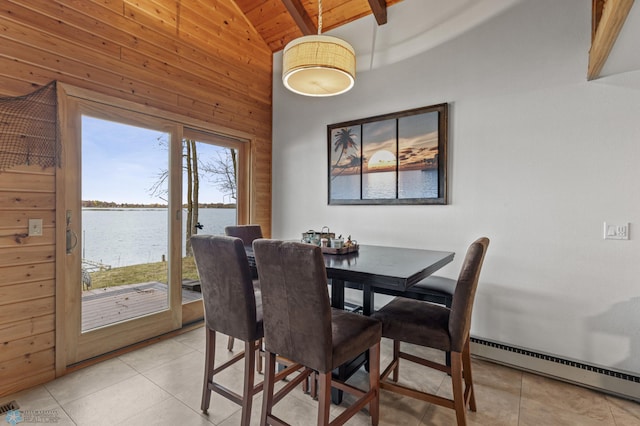 tiled dining space with a water view, wood walls, lofted ceiling with beams, baseboard heating, and wood ceiling