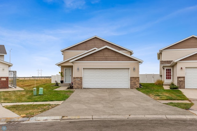 view of front of house featuring a front lawn and a garage