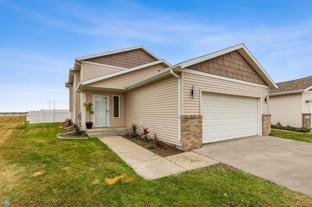 view of front facade featuring a front lawn and a garage