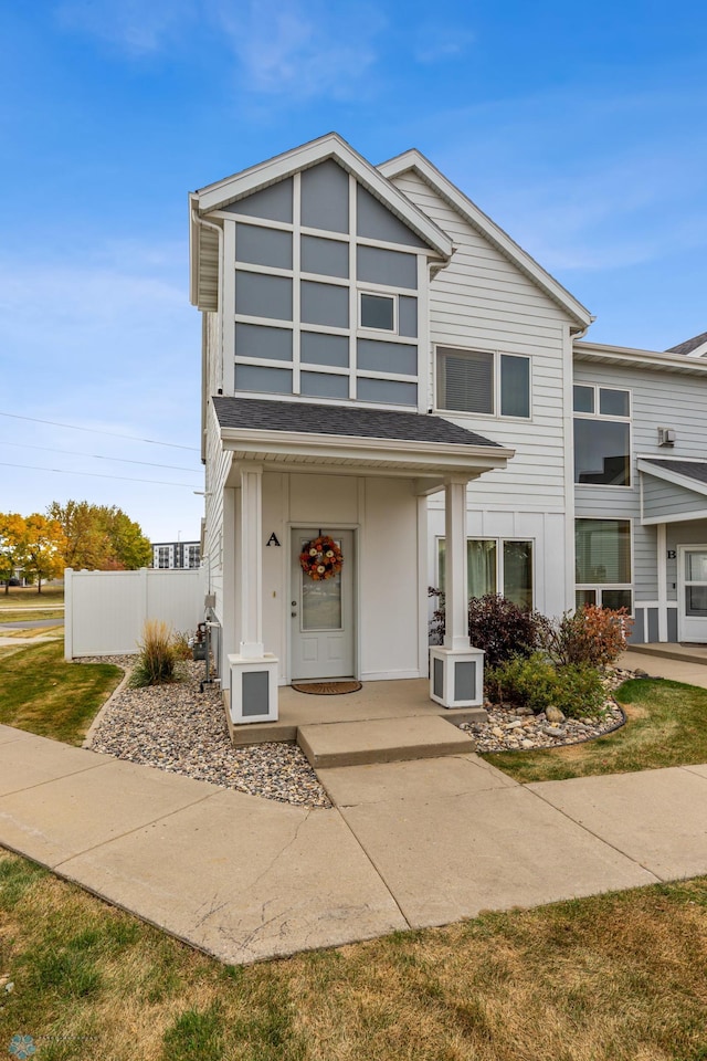 view of front of home with a front yard and covered porch