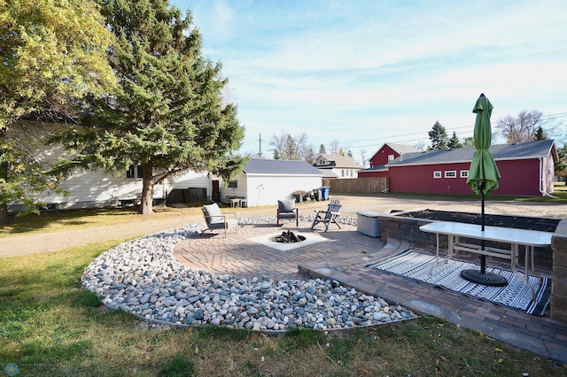 view of patio featuring a fire pit and a wooden deck