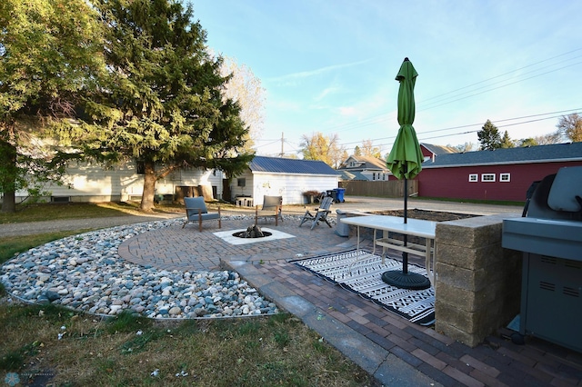 view of patio / terrace with an outdoor fire pit