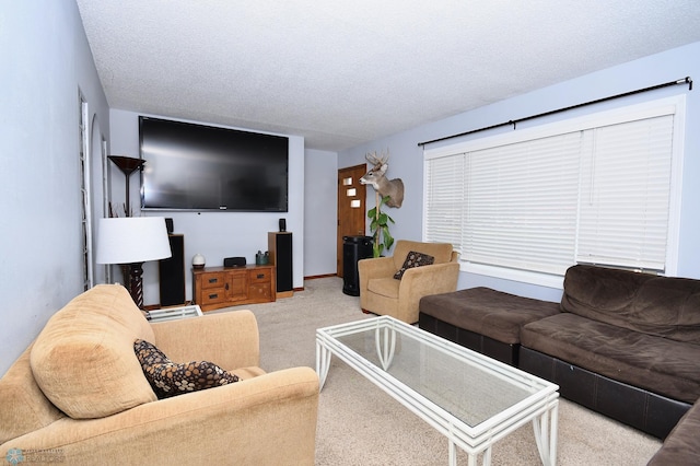 living room featuring light carpet and a textured ceiling