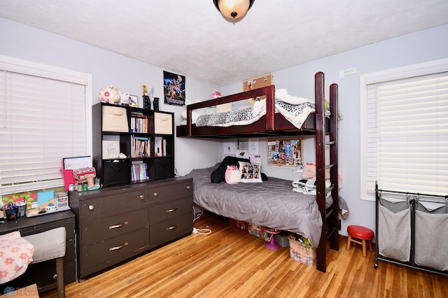 bedroom with light hardwood / wood-style floors