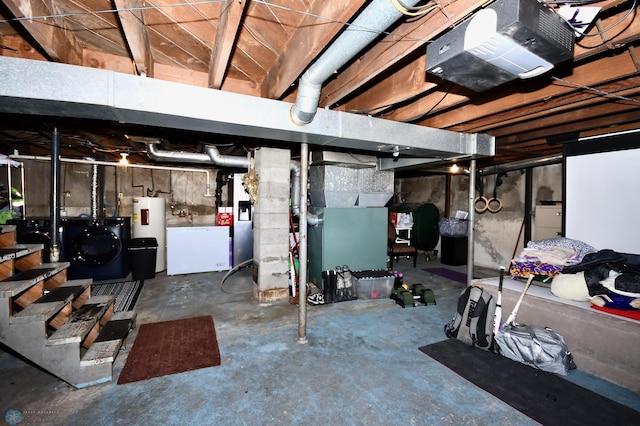 basement with washer / dryer, electric water heater, and heating unit