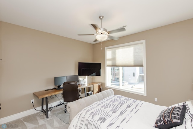 bedroom featuring light carpet and ceiling fan