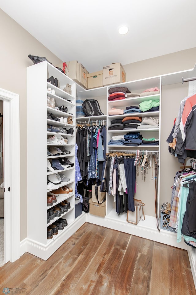 spacious closet featuring hardwood / wood-style floors