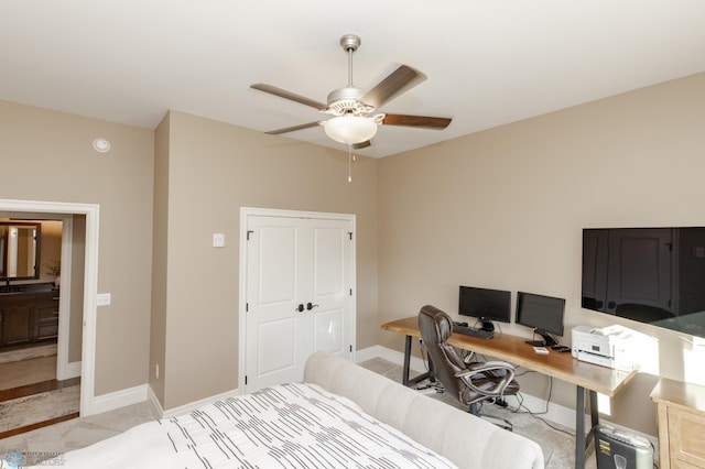 carpeted bedroom featuring a closet and ceiling fan