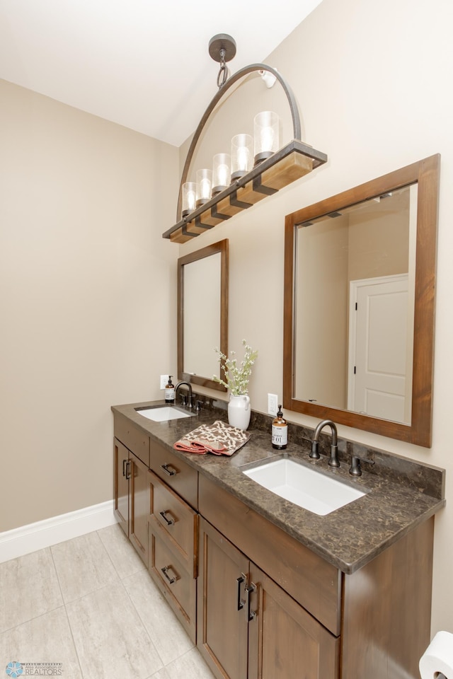 bathroom with vanity and tile patterned floors