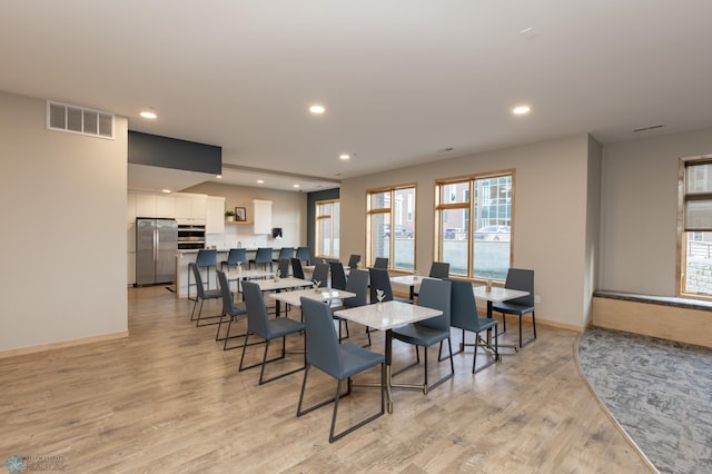 dining room with light hardwood / wood-style flooring