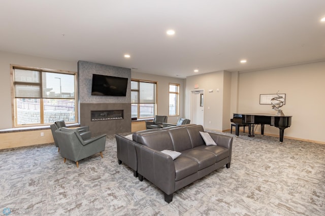 carpeted living room featuring a fireplace