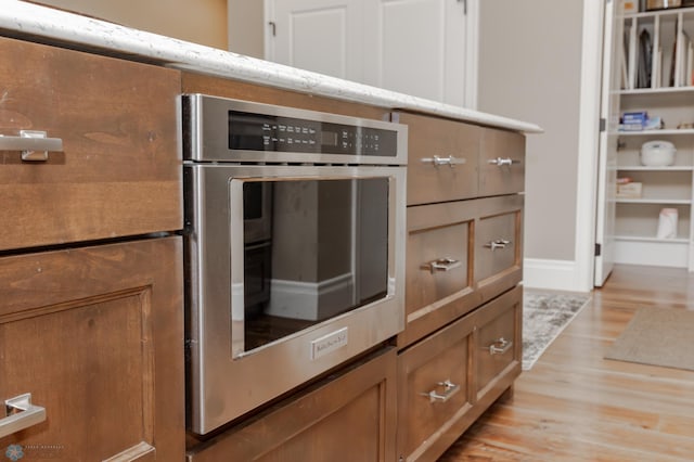 kitchen with light hardwood / wood-style flooring