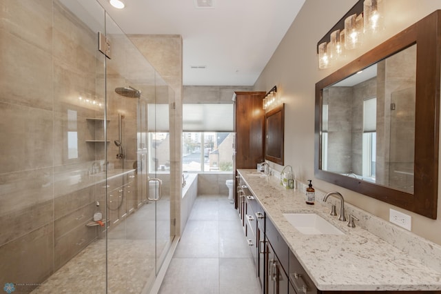 bathroom with vanity, plus walk in shower, and tile patterned floors