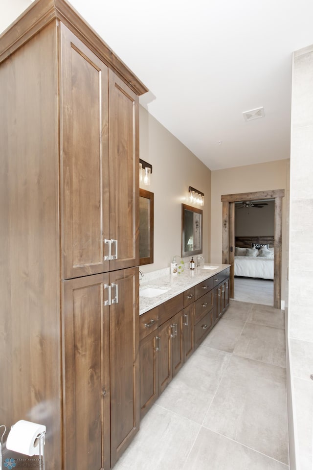 bathroom featuring vanity and tile patterned flooring