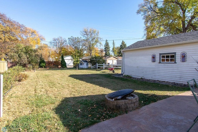 view of yard featuring a patio area and a shed