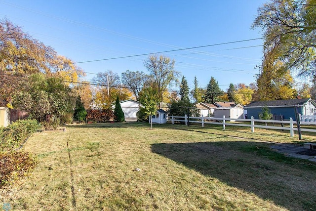 view of yard featuring a storage unit