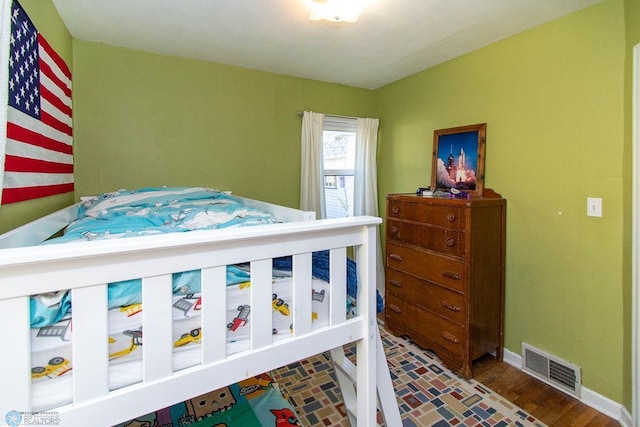 bedroom featuring hardwood / wood-style flooring