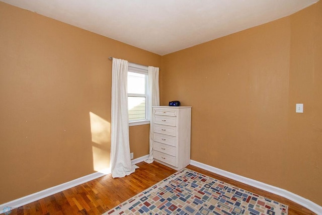 unfurnished bedroom featuring hardwood / wood-style floors