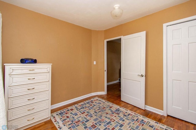 bedroom with hardwood / wood-style flooring