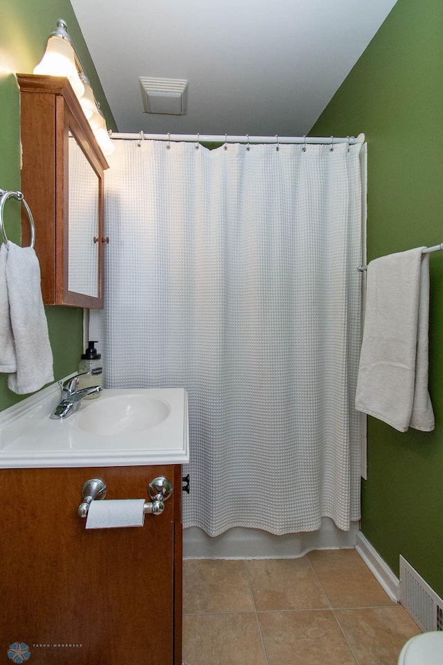 bathroom featuring vanity, a shower with shower curtain, and tile patterned flooring