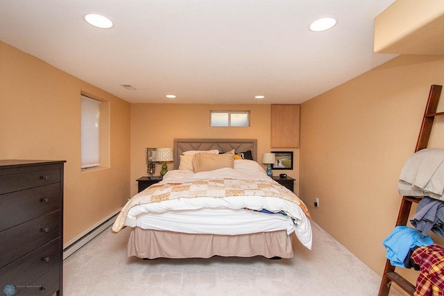 bedroom featuring a baseboard heating unit and carpet