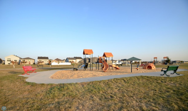 view of playground with a lawn