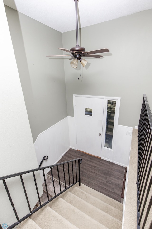 stairway featuring wood-type flooring