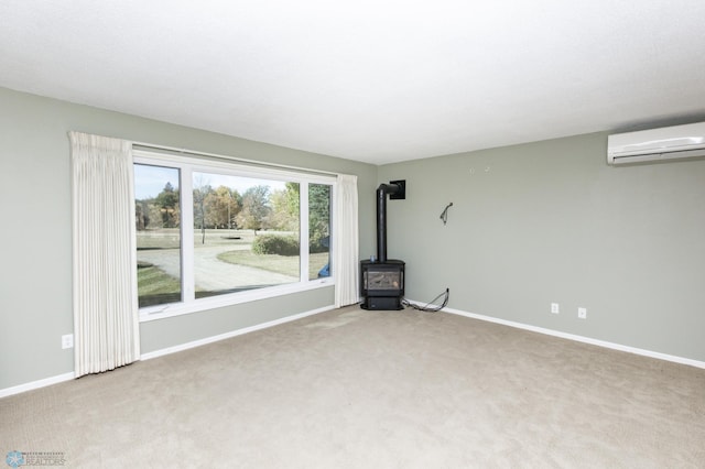 carpeted empty room with a wood stove and an AC wall unit