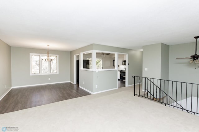 empty room with an inviting chandelier and hardwood / wood-style flooring