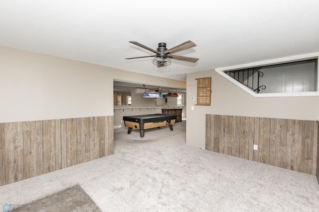 rec room featuring ceiling fan, wood walls, carpet, and billiards