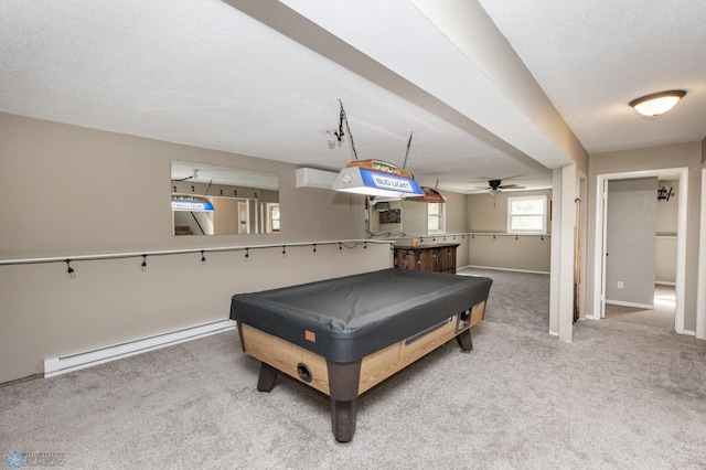 playroom with a baseboard heating unit, carpet floors, ceiling fan, a wall mounted AC, and billiards