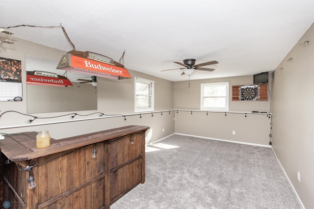 kitchen featuring light carpet and ceiling fan