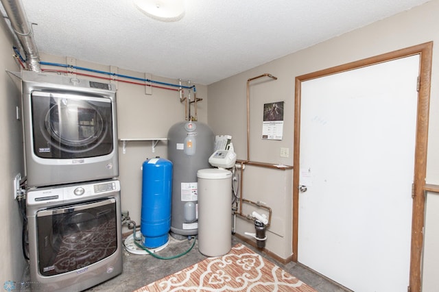 laundry area featuring stacked washing maching and dryer and a textured ceiling