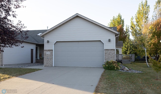 ranch-style home featuring a front yard and a garage