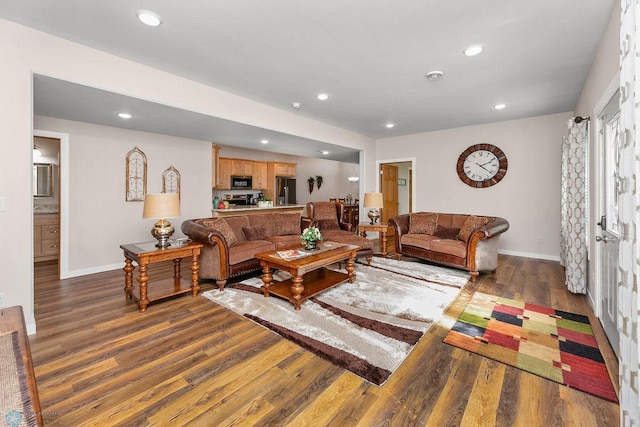 living room with dark hardwood / wood-style floors