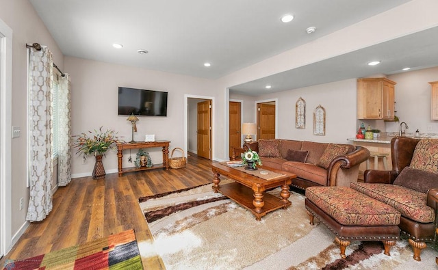 living room with dark hardwood / wood-style flooring