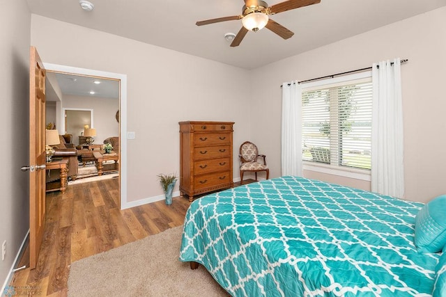 bedroom with hardwood / wood-style flooring and ceiling fan