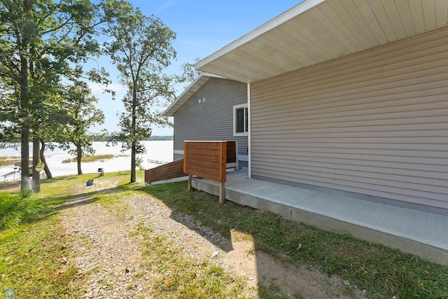 view of side of home featuring a water view