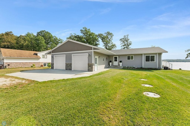 ranch-style home featuring a front yard and a garage