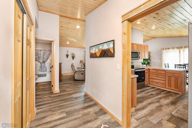 hallway featuring wooden ceiling, vaulted ceiling, and dark hardwood / wood-style flooring